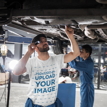 T-Shirt Mockup Featuring a Man Fixing a Car