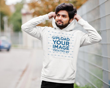 Hoodie Mockup of a Fashionable Bearded Man Walking on the Street