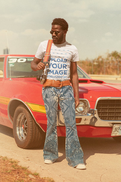 T-Shirt Mockup of a Man in a Retro Outfit Posing by a Muscle Car m10481