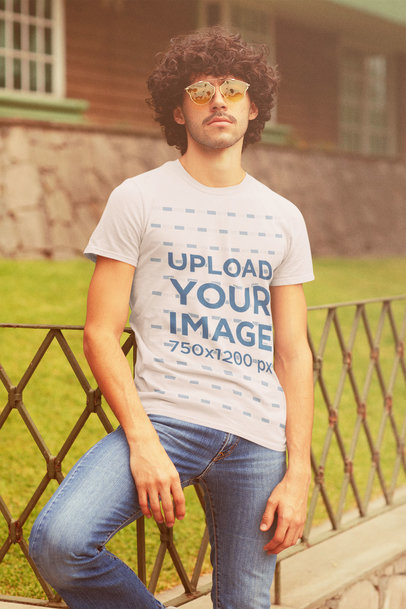 T-Shirt Mockup of a Curly-Haired Man With a Retro Style 