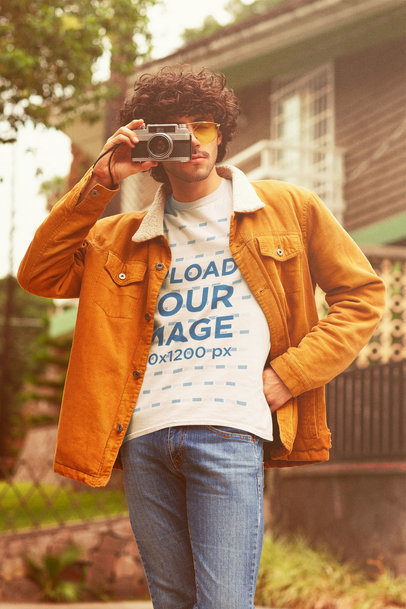 Retro Mockup of a Curly-Haired Photographer Wearing a T-Shirt