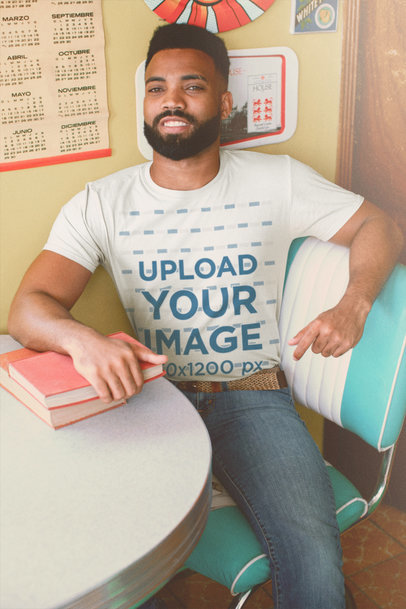 Round-Neck Tee Mockup of a Smiling Man at a Retro Setting