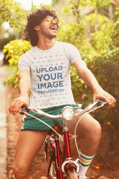 Retro-Themed T-Shirt Mockup Featuring a Happy Man Riding a Bicycle
