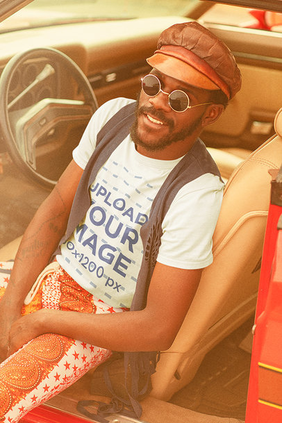 T-Shirt Mockup Featuring a Bearded Man in a Retro Car 