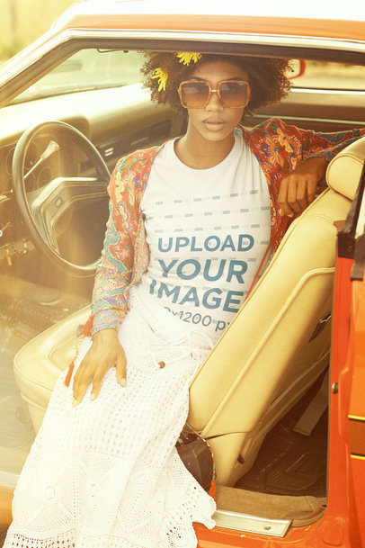 70's T-Shirt Mockup Featuring a Hippie Woman Posing in a Car Seat