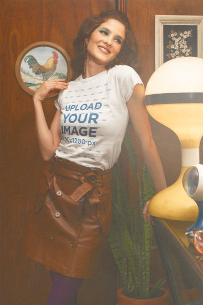 T-Shirt Mockup of a Smiling Woman Posing in a House with Retro Decor m10532
