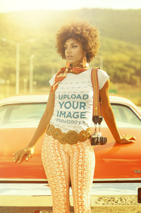 T-Shirt Mockup of a Woman Leaning on the Trunk of a Car in the 70s