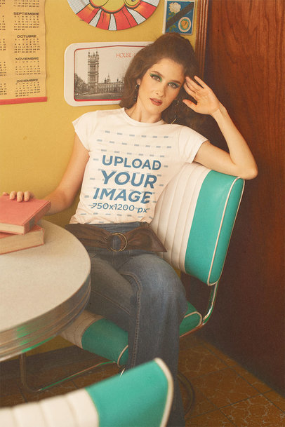 T-Shirt Mockup of a Woman in a Dining Room with a 70's Aesthetic m10536