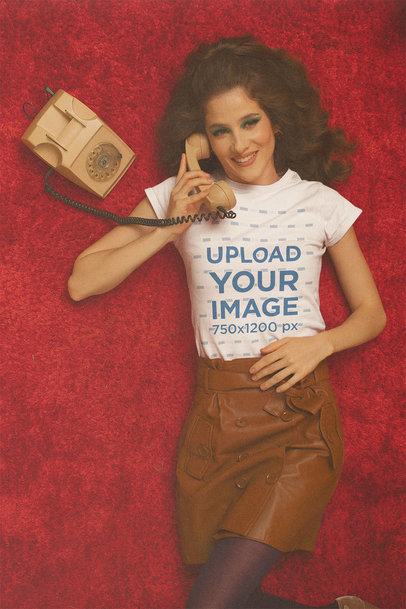 T-Shirt Mockup Featuring a Woman Talking on a Retro Telephone m10533