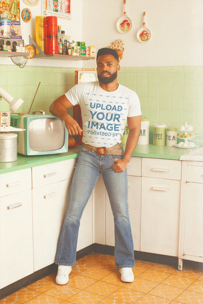 T-Shirt Mockup of a Man Inside a 70's Kitchen