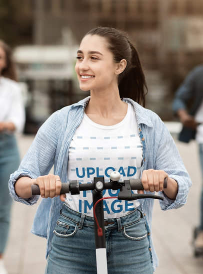 T-Shirt Mockup of a Smiling Woman Riding an Electric Scooter