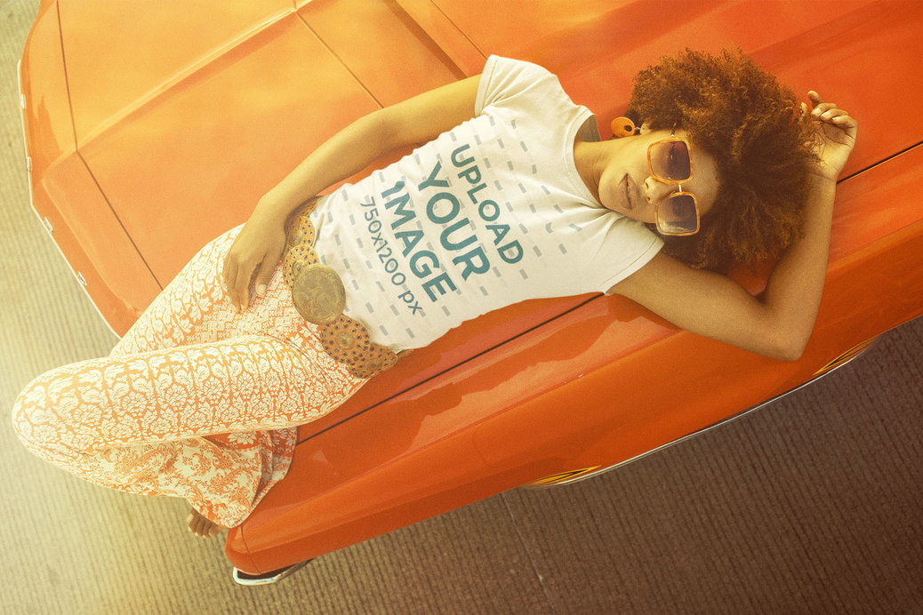 T-Shirt Mockup Featuring a Woman Lying on a Vintage Car Hood 