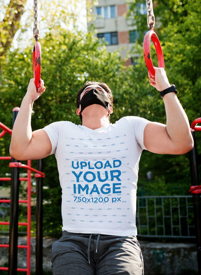 V-Neck T-Shirt Mockup Featuring a Man Doing Exercise at a Park