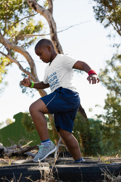 T-Shirt Mockup of a Boy Running Through an Obstacle Course 40739-r-el2