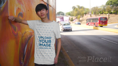 T-Shirt Video Featuring a Man Posing by Street Art T-Shirt Video Featuring a Man Posing by Street Art 