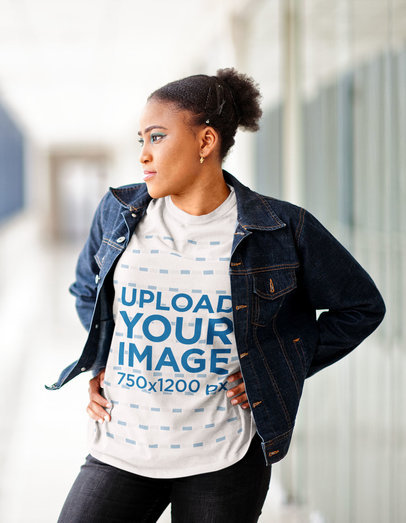 Round-Neck T-Shirt Mockup of a Woman with Afro Hair Posing in a Hallway