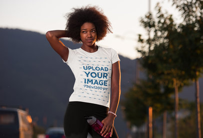 Activewear Mockup Featuring a Curly-Haired Woman Wearing a T-Shirt