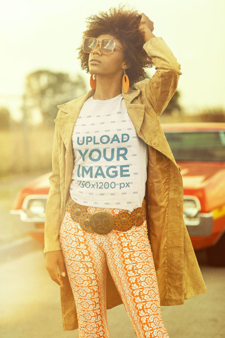 T-Shirt Mockup of a Curly Hair Woman Posing Near a Vintage Car 