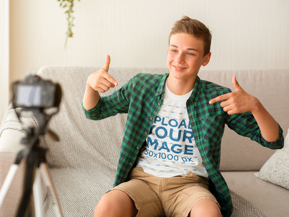 Placeit - T-Shirt Mockup of a Boy Recording a Vlog