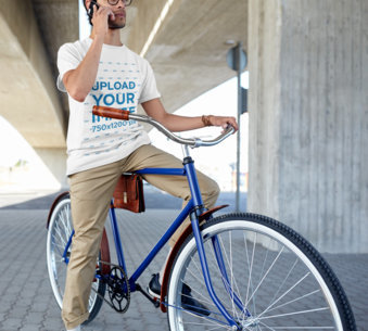 T-Shirt Mockup Featuring a Man on His Bicycle Talking on the Phone 45145-r-el2