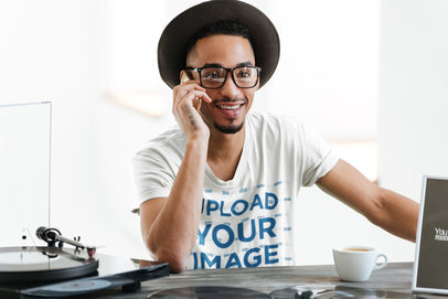 T-Shirt Mockup of a Man With Glasses Talking on the Phone