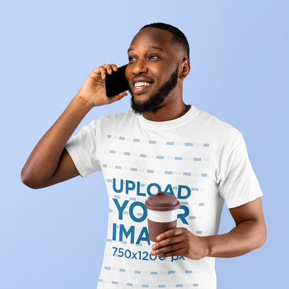 T-Shirt Mockup of a Happy Bearded Man Making a Call at a Studio