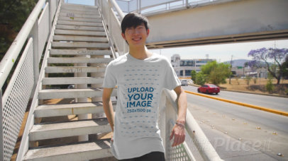 Video of a Young Man Wearing a T-Shirt in an Urban Environment