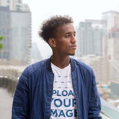 T-Shirt Mockup of a Man Taking a Walk in the City
