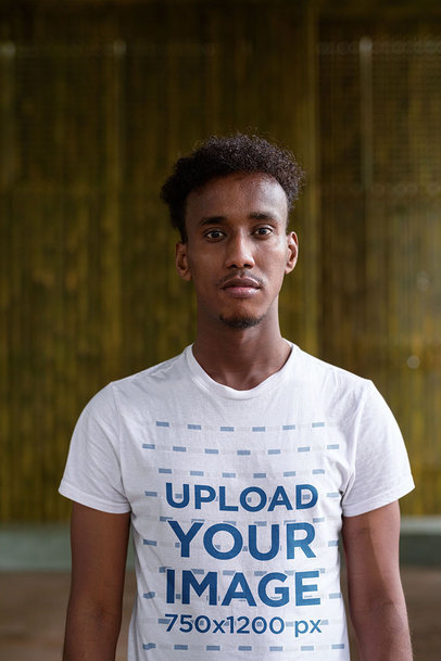 T-Shirt Mockup of a Young Man Looking Straight to the Camera