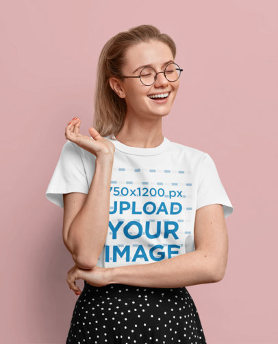 T-Shirt Mockup of a Happy Woman With Glasses Posing at a Studio