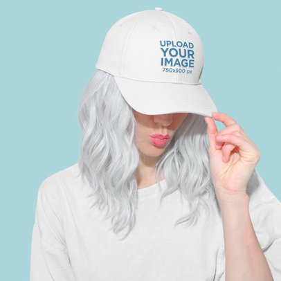 Mockup of a Stylish Woman Covering Her Eyes With Her Dad Hat M5602-r-el2