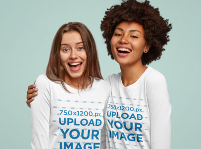 Long Sleeve Tee Mockup Featuring Two Cheerful Women Hugging at a Studio