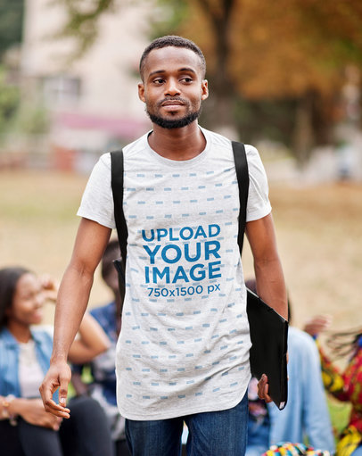 Heathered T-Shirt Mockup Featuring a College Man Student