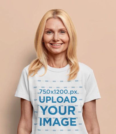 T-Shirt Mockup of a Woman With Blond Hair Standing in a Studio