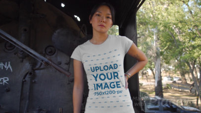 T-Shirt Video of a Woman Posing by an Abandoned Locomotive