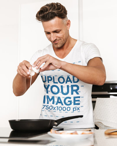 V-Neck T-Shirt Mockup of a Man Cooking Breakfast