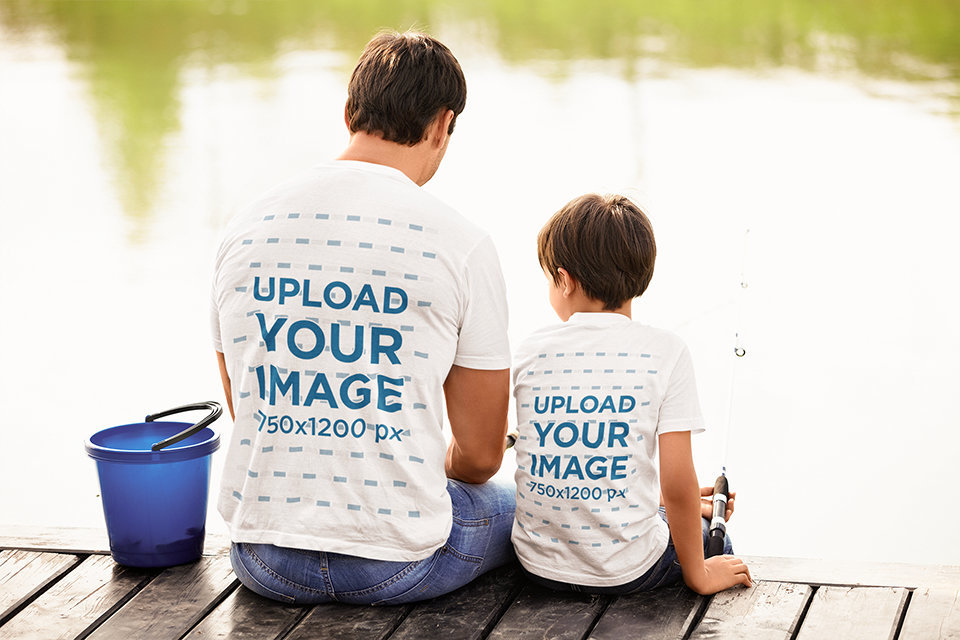 Back-View T-Shirt Mockup Featuring a Kid and His Dad Fishing at a Lake