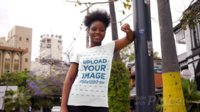 T-Shirt Video of a Happy Woman Posing by an Urban Lamp Post 3407v