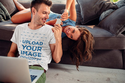 T-Shirt Mockup of a Joyful Man Playing with His Girlfriend at Home