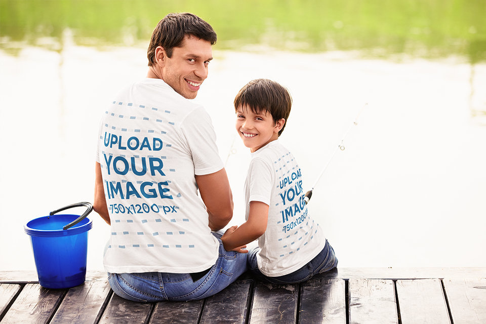 Back-View Tee Mockup Featuring a Happy Father Fishing with His Son at a Lake