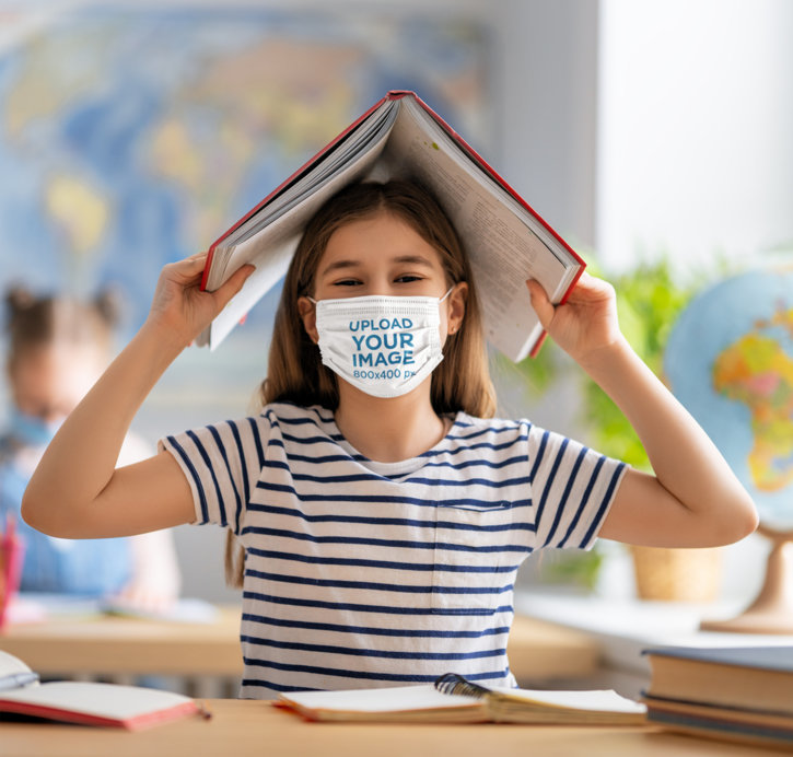 Face Mask Mockup Featuring a Happy Girl Smiling at a Classroom