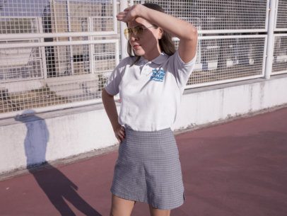 Woman Wearing a Skirt and a Polo Shirt Mockup While at a Terrace