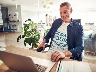Round-Neck Tee Mockup Featuring a Senior Man at an Office