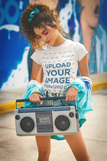 T-Shirt Mockup Featuring a Woman Holding a Retro Boombox 