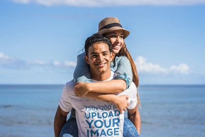T-Shirt Mockup Featuring a Man at the Beach With His Girlfriend