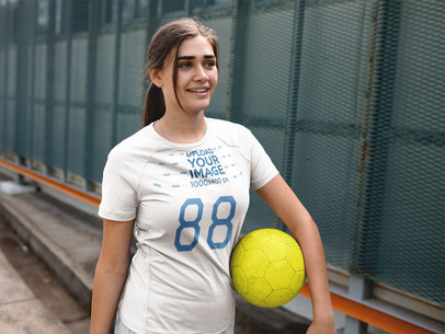 Custom Soccer Jerseys - Smiling Girl Carrying the Ball