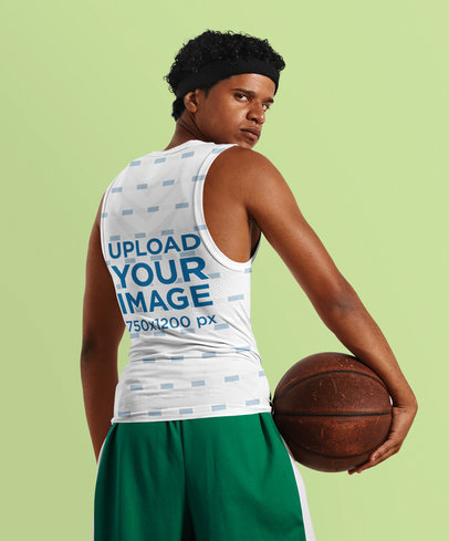 Back View Tank Top Mockup of a Serious Basketball Player Man Holding a Ball