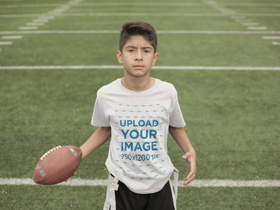 Custom Football Jerseys - Kid Holding the Ball at the Field