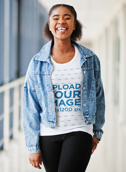 T-Shirt Mockup Featuring a Smiling Woman With a Denim Jacket