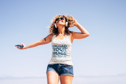 Heathered Tank Top Mockup Featuring a Cheerful Woman Listening to Music